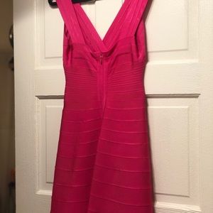 Pink Herve Leger cocktail dress in bandage knit.